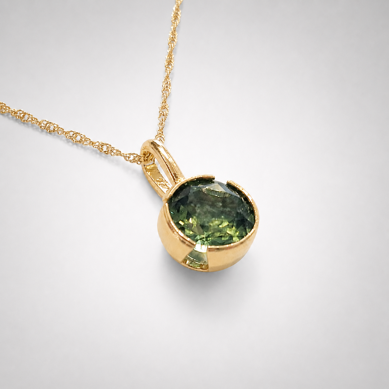 Peridot set in a 14K Gold Open Bezel